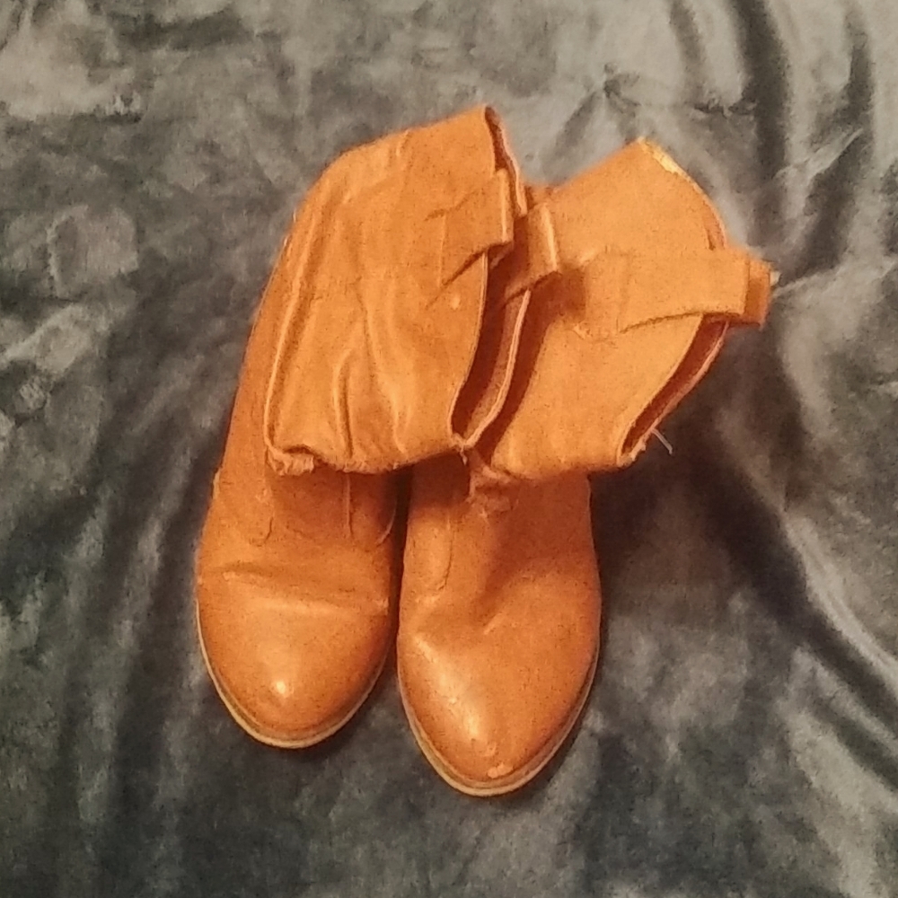 Leather brown boots. Ankle high.